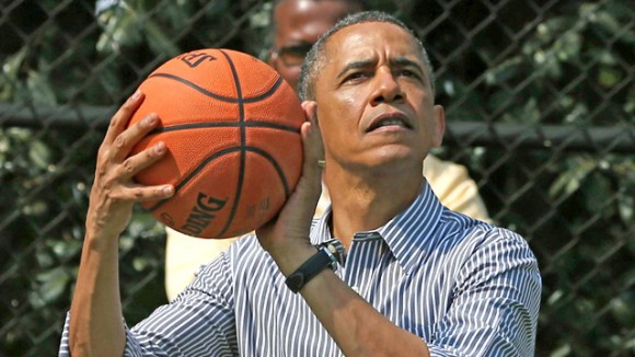 Barack Obama holds basketball